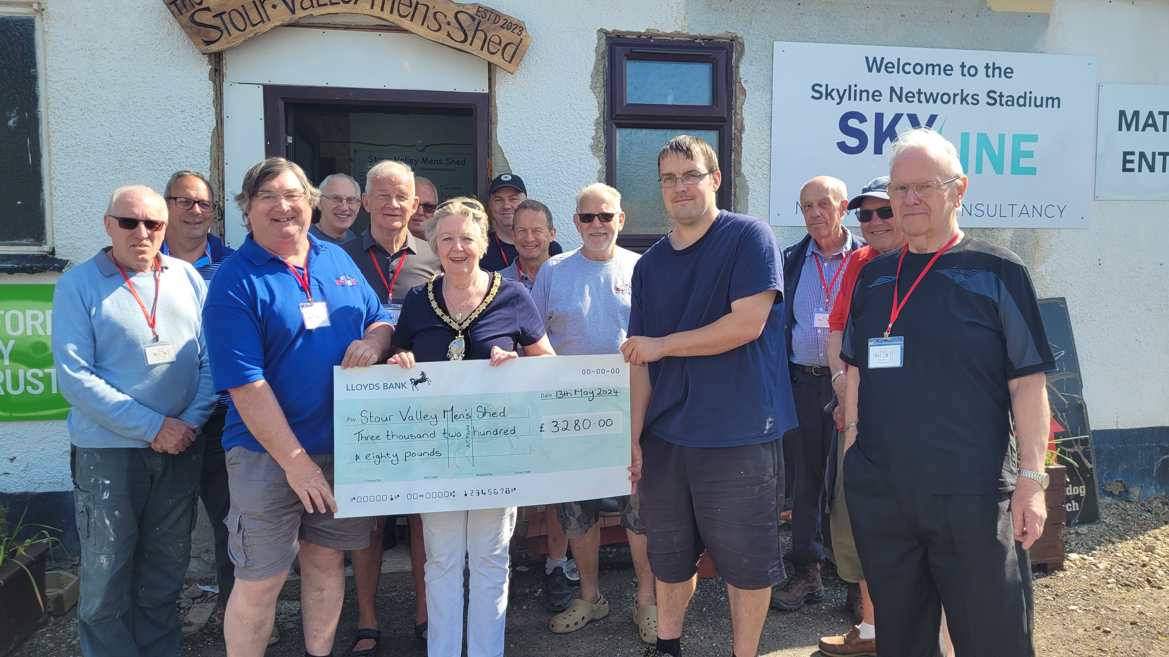 Babergh Council Chair, Cllr Malvisi presents the cheque to the Stour Valley Men’s Shed Chairman Adrian Beckham